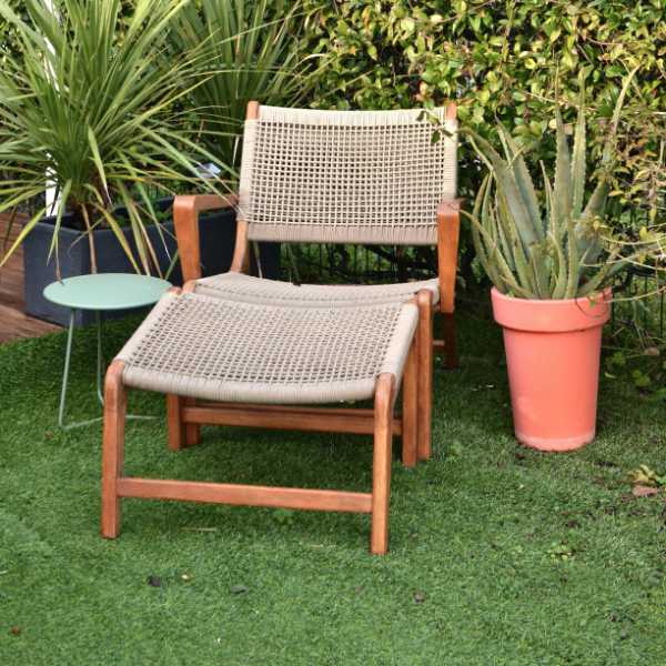 Chair sitting on artificial turf in a backyard